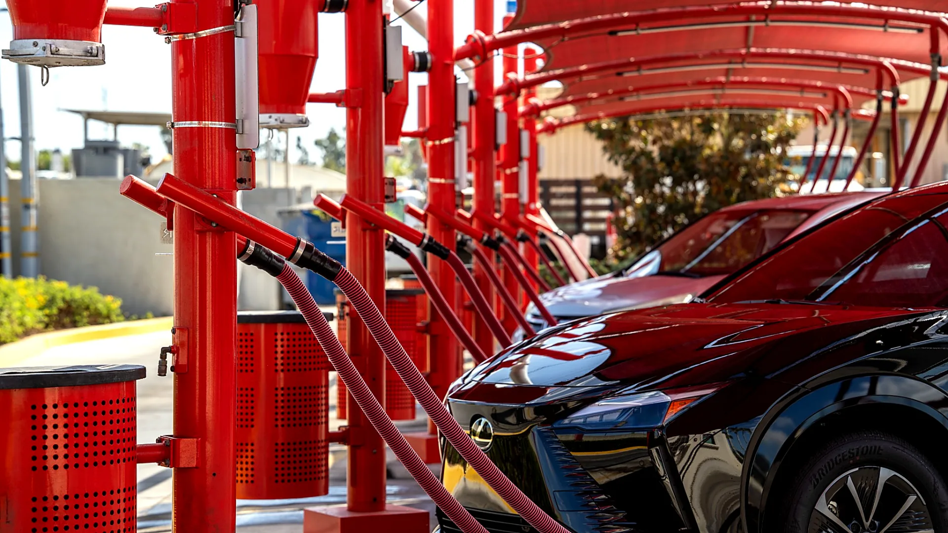 Row of red free vacuum stations at Seal Shine Express Car Wash